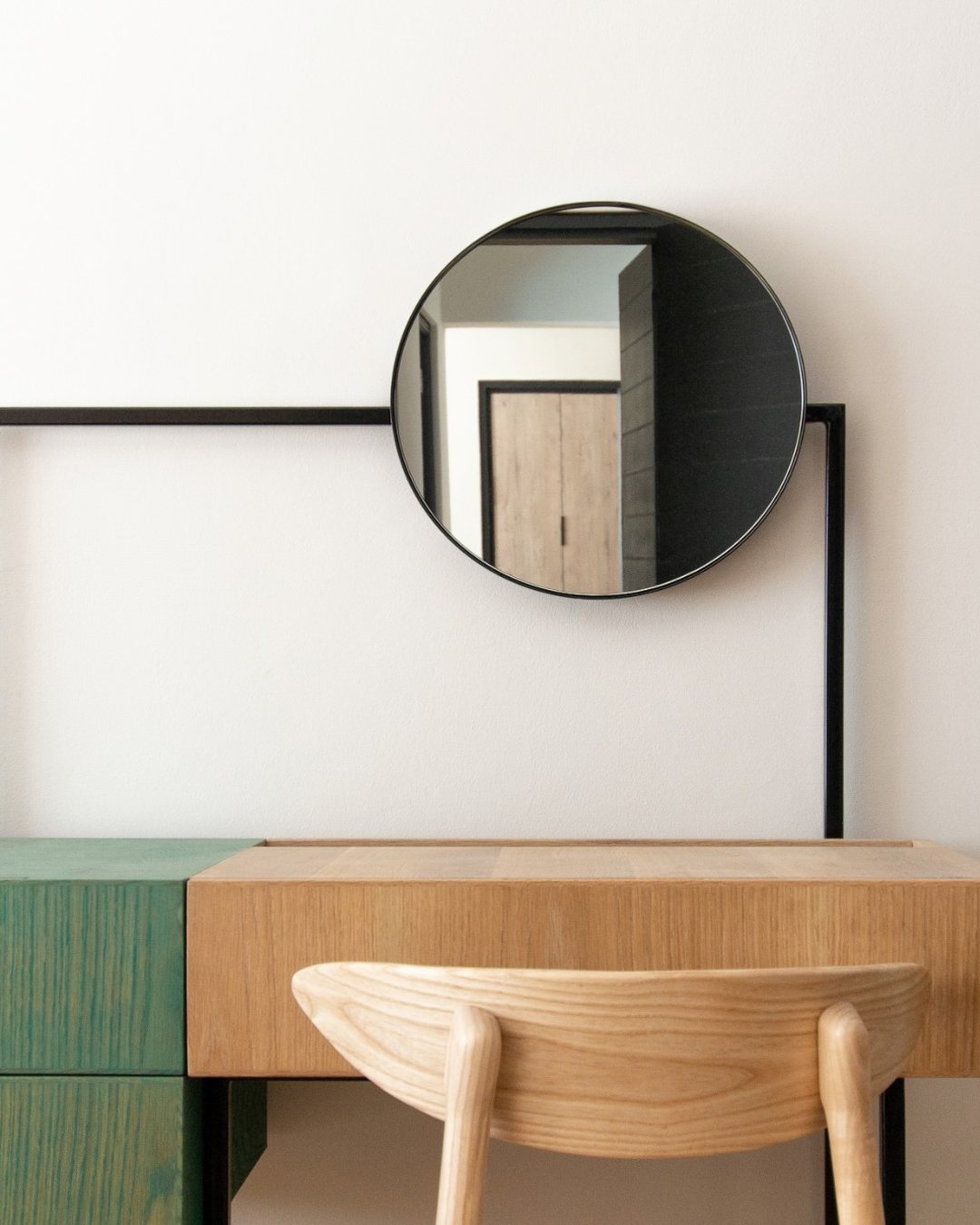 Hyatt House Johannesburg: an oak and green vanity with a round mirror in a guest room