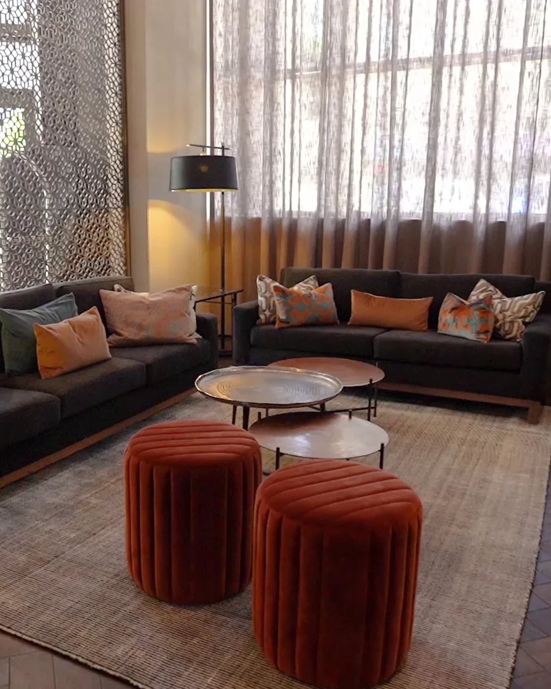 Hyatt Regency Cape Town: the lounge, with velvet ottomans and a screened window
